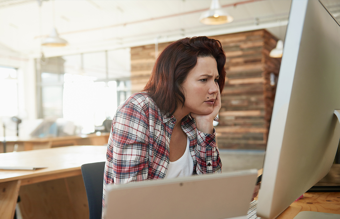 women in front of computer looking confused