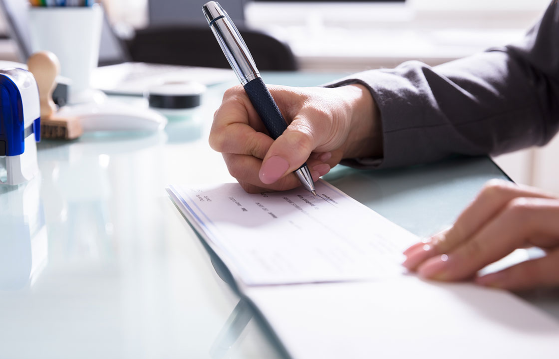 person signing cheque